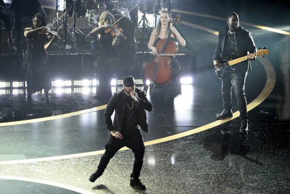 Rapper Eminem shocks Oscars with performance 17 years late AP News